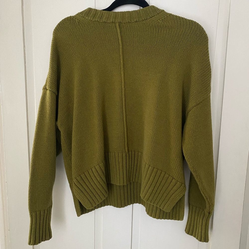 A New Day green sweater